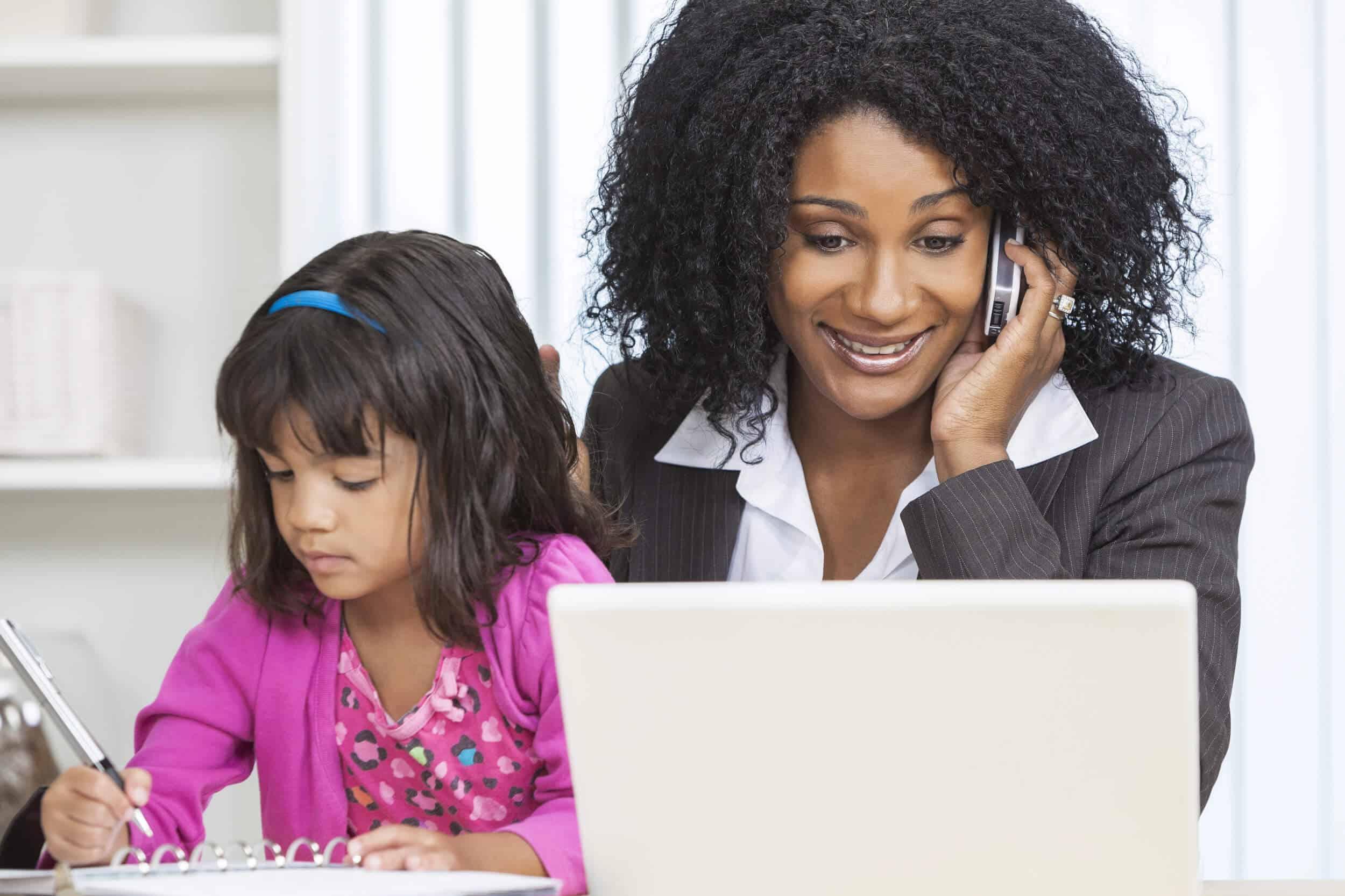 woman at laptop with child