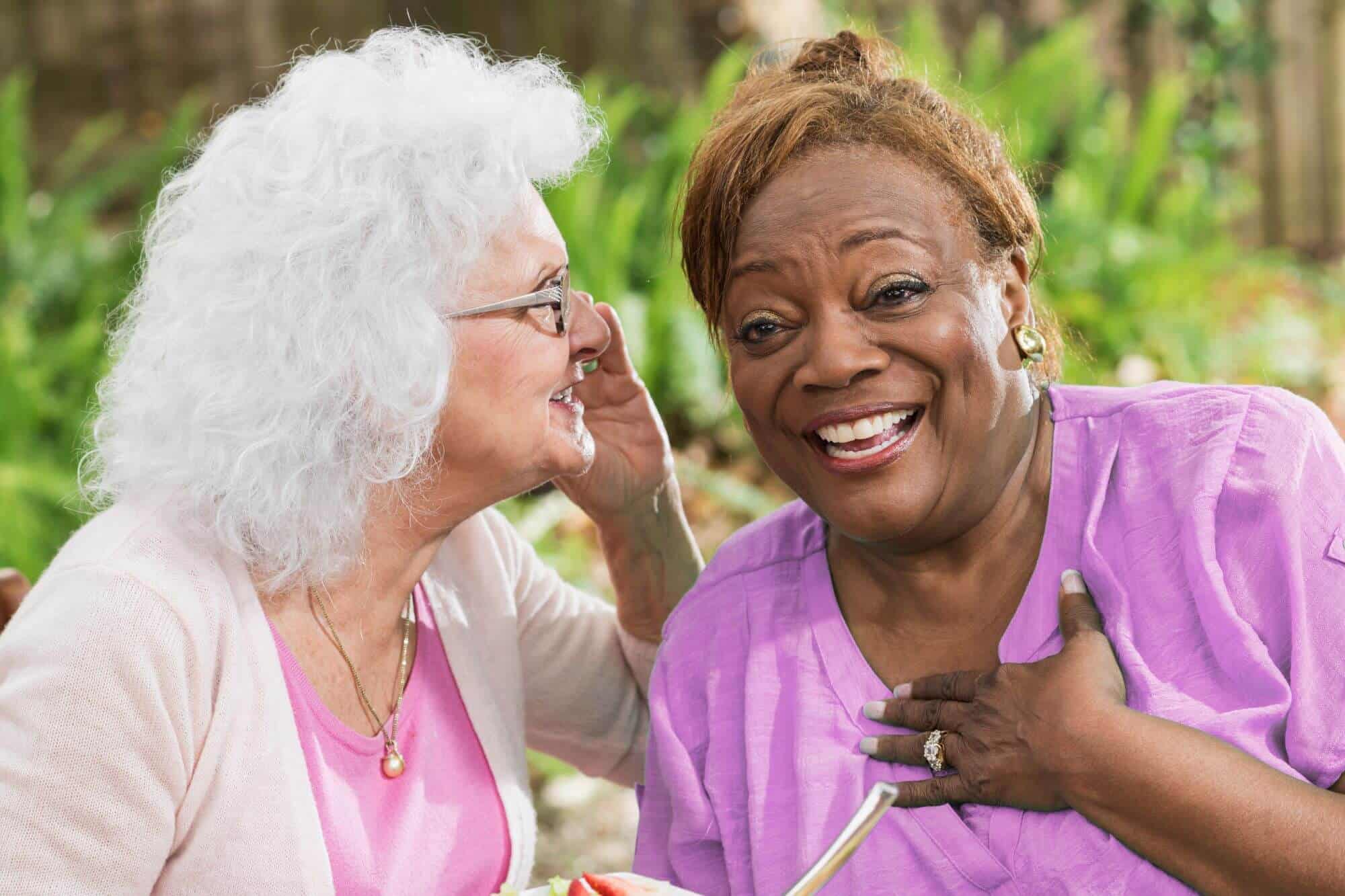 black woman and white woman laughing