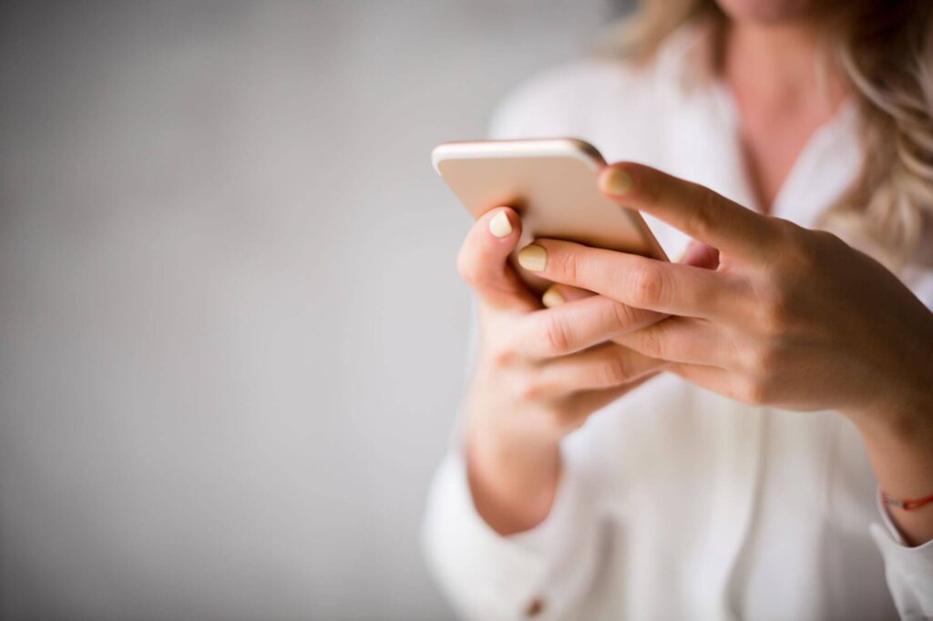 woman scrolling on a mobile phone
